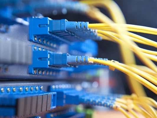 Fiber optic cables connected to a patch panel
